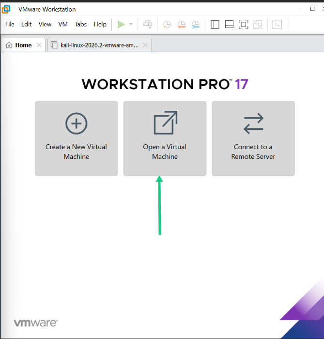 The VMware Workstation Pro home screen dashboard showing the 'Open a Virtual Machine' option highlighted with a green arrow.