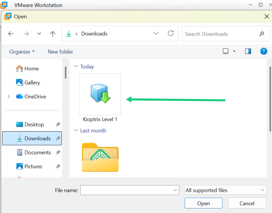 Windows File Explorer open file dialog box showing the download folder with the Kioptrix Level 1 virtual machine image file.